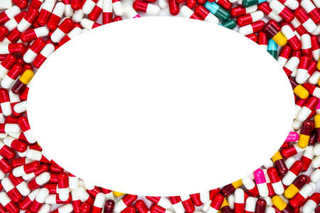 Colorful of antibiotics capsule pills oval frame on white background with copy space. Drug resistance concept. Antibiotics drug use with reasonable and global healthcare concept.の写真素材