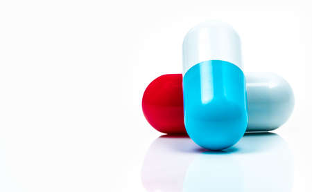 Two capsule pills isolated on white background. Global healthcare concept.の写真素材