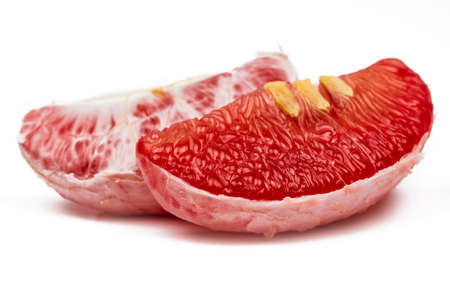 Red pomelo pulp with seeds isolated on white background. Thailand Siam ruby pomelo fruit. Natural...