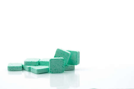 Macro shot to show the detail of green medical lozenges for a relief cough, sore throat and throat...