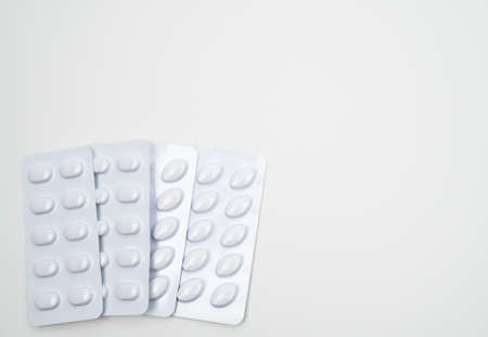 Statins tablets pill in white blister pack for light resistance packaging isolated on white background. Medicine for treatment dyslipidemia. Lipid lowering tablets pills. Statins : Hyperlipidemia.の写真素材