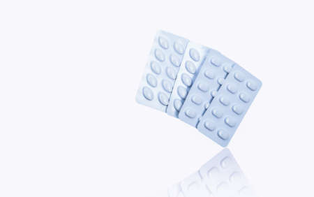 Statins tablets pill in white blister pack for light resistance packaging isolated on white background. Medicine for treatment dyslipidemia. Lipid lowering tablets pills. Statins : Hyperlipidemia.の写真素材