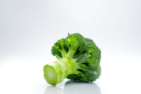 Green broccoli (Brassica oleracea). Vegetables natural source of betacarotene, vitamin c, vitamin k, fiber food, folate. Fresh broccoli cabbage isolated on white background.の写真素材