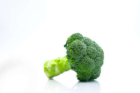 Green broccoli (Brassica oleracea). Vegetables natural source of betacarotene, vitamin c, vitamin k, fiber food, folate. Fresh broccoli cabbage isolated on white background with copy space.の写真素材