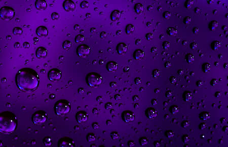 Macro shot detail reflection of dollars banknote in water drops. Purple water drops background