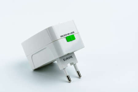Universal plug adapters for travel around the world isolated on white background.の写真素材