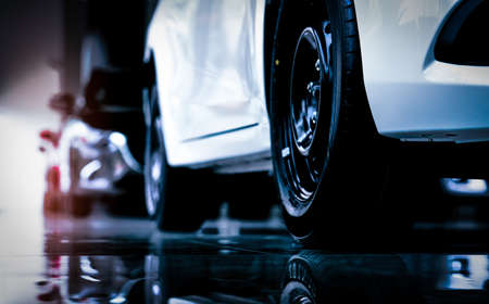 Closeup new luxury SUV compact car parked in modern showroom for sale. Car dealership office. Car retail shop. Electric car technology and business conceptの写真素材