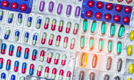 Colorful of tablets and capsules pill in blister packaging arranged with beautiful pattern....