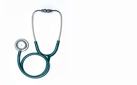 Green stethoscope isolated on white background with copy space. Medical tool for doctor. Health check up concept. Medical equipment for listen heart beat. Clinical Cardiology concept.の写真素材