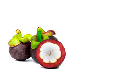 Three whole purple mangosteen and another cross section isolated on white background. Tropical fruit from Thailand. The queen of fruits. Asia fresh fruit market. Natural source of tannin and xanthonesの写真素材