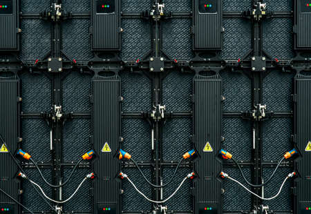 Backside of big LED screen monitor display.  Texture of back view of LED panels. Power input and...