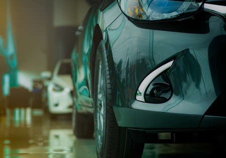 New luxury grey car parked in modern showroom for sale. Car dealership office. Car retail shop....