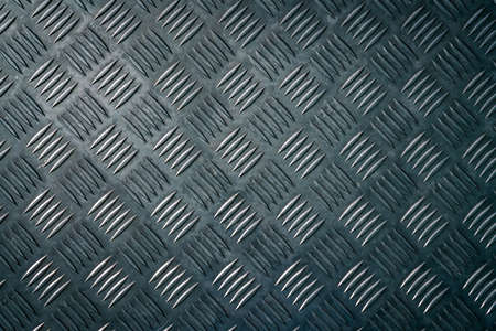 Industrial metal checker plate. Metal checker plate texture background. Metal checkerplate for anti skid. Embossed metal sheet floor. Silver bump ground with art pattern. Silver texture background.の写真素材