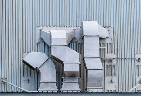 Exhaust air ventilation system. Air Handling Unit. Ventilation system of shopping mall. AHU. Exterior building pipe. Exhaust air system for clean and flow in building. Air pollution, PM 2.5 concept.の写真素材