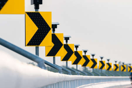 Traffic sign with solar cell panel power on white sky background. Electric pole with solar energy. Green energy concept. Renewal energy. Alternative electricity source. Sustainable resourcesの写真素材