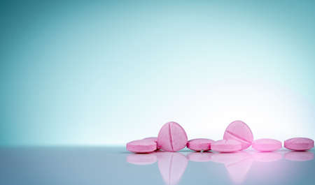 Pink tablets pills with shadow on gradient background. Pharmaceutical industry. Pharmacy products....