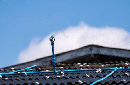 Install the sprinkler on the tile roof to reduce the temperature inside the building of house....