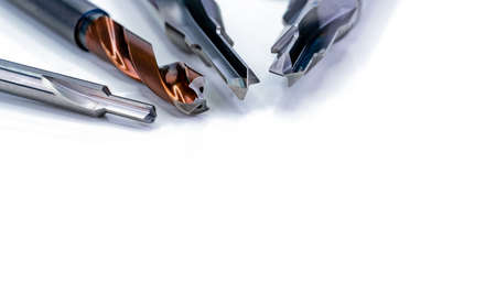 Special tools isolated on white background. Made to order special tools. Coated step drill and reamer detail. HSS cemented carbide. Carbide cutting tool for industrial applications. Engineering tools.の写真素材