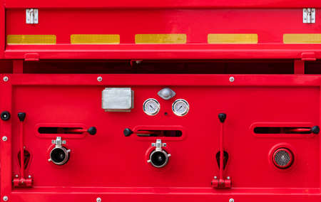 Fire truck. Rescue engine. Side view of red firetruck vehicle. Fire department truck. High pressure...