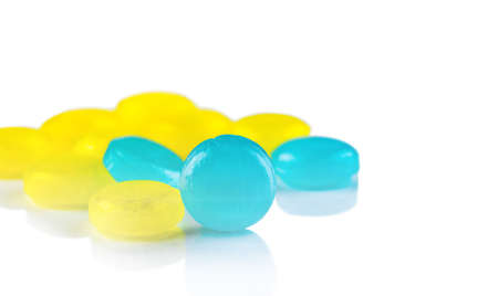Medical lozenges for relief cough, sore throat and throat irritation isolated on white background....