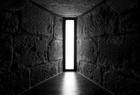 Perspective view of concrete and stone wall with skylight glass window. Interior architecture design. House interior. Light design for home building. Light in the end of way. Light of hope concept.の写真素材