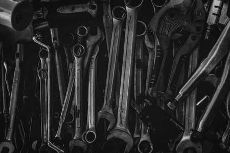 Pile of old wrench. Mechanic tools. Closeup set of spanner in tool box. Chrome wrench at garage workshop. Equipment for repair car or motorcycle. Hardware for technician service. Many size of wrench.の写真素材