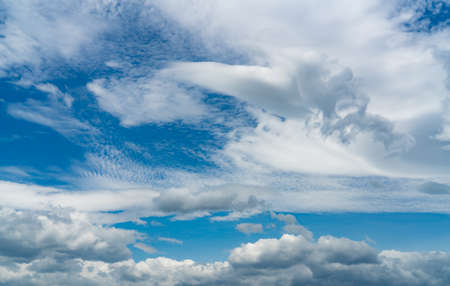 Beautiful blue sky and white cumulus clouds abstract background. Cloudscape background. Blue sky and fluffy white clouds on sunny day. Nature weather. Bright day sky for happy day background.の写真素材