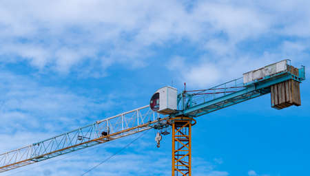 Construction site with crane and building. Real estate industry. Crane use reel lift up equipment in...