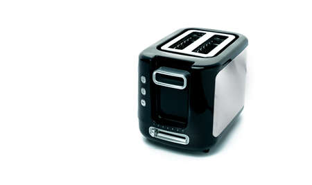 Black toaster isolated on white background. Brushed stainless steel toaster for bread toast. Two...