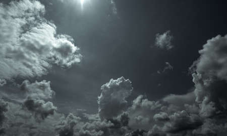 Dark dramatic sky and clouds. Background for death and sad concept. Gray sky and fluffy white...