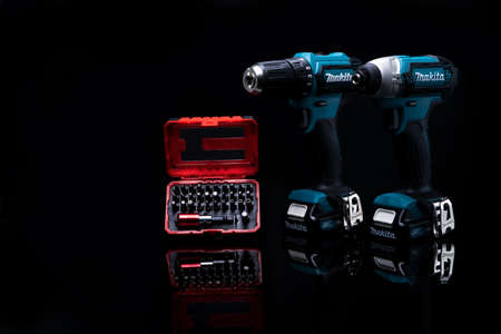 CHONBURI, THAILAND-MAY 24, 2020 : Makita codless driver drill with screw bit set in case on dark background. Makita tools. Single sleeve keyless driver drill chuck for easy bit installation/ removal.のeditorial素材