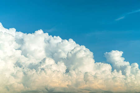 White fluffy clouds on blue sky. Soft touch feeling like cotton. White puffy clouds cape with space...