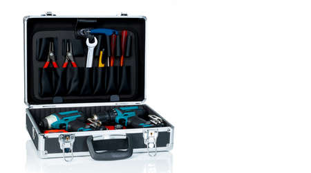 Toolbox isolated on white background. Black toolbox with tools. Pliers, spanner or wrench,...