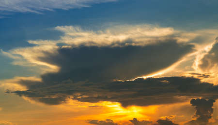 Golden sunset sky. Heaven sky. Blue and yellow sky with white cloud. Golden sun light at dusk....