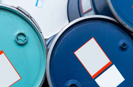 Old chemical barrels. Blue and green oil drum. Steel and plastic oil tank. Toxic waste warehouse....