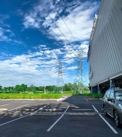 Car parking space at shopping mall for customer service. Outdoors asphalt car parking lot on sunny...
