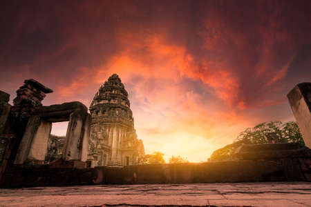 Selective focus on Phimai Historical Park with sunset sky. Landmark of Nakhon Ratchasima, Thailand. Travel destinations. Historic site is ancient. Ancient building. Khmer temple classical architectureの写真素材