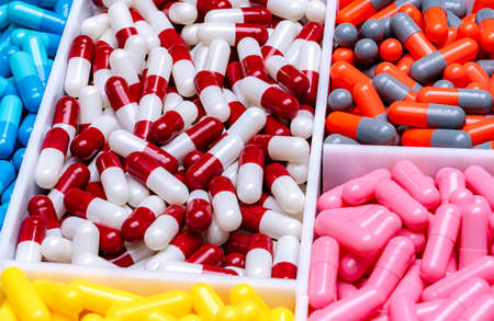 Capsule pills in plastic tray. Pharmaceutical industry. Drug production. Pharmaceutics concept....