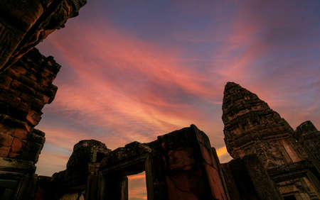 Phimai Historical Park with blue and golden sunset sky. Landmark of Nakhon Ratchasima, Thailand. Travel destinations. Historic site is ancient. Ancient building. Khmer temple classical architecture.の写真素材