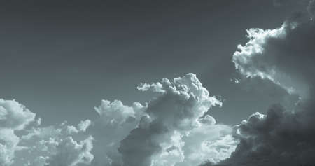 Dark dramatic sky and clouds. Background for death and sad concept. Gray sky and fluffy white...