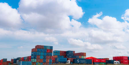 SAMUT PRAKAN, THAILAND-MAY 15, 2021 : Container at container yard for rent and truck. Container logistic. Freight transportation. Logistic industry. Container for truck transport. Cargo business.のeditorial素材