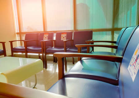 Social distancing. Empty dark blue chair with gap for social distance to prevent  at waiting room in...