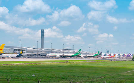 SAMUT PRAKAN, THAILAND-MAY 15, 2021 : Cargo aircraft parked at airfield in the airport near airport terminal. Cargo plane of EVA Air, K-Mile Air, and Thai Airways. Air logistic business. Air cargo.のeditorial素材