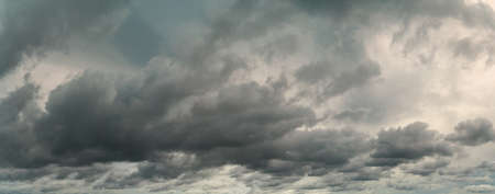 Panorama view of overcast sky. Dramatic gray sky and white clouds before rain in rainy season....
