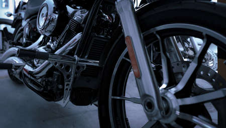 Selective focus on motorcycle frame. Closeup motorcycle exhaust pipe, engine guard, and foot rest....