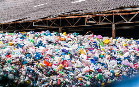 SAMUT PRAKAN, THAILAND-OCTOBER 27, 2021 : Pile of plastic bottle. Plastic bottle waste for recycle in recycling business. Household plastic waste for recycle. PET rubbish. Pile of plastic waste.のeditorial素材