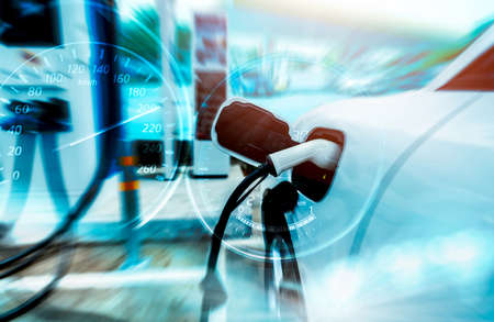 EV car charging at outdoor electric car charging station. EV car charging point. Electric vehicle...