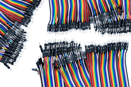 Ribbon cable or multi-wire planar cable on white background. Flat ribbon cable with pin connectors....