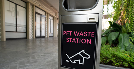 Pet waste station. Pet waste cleanup. Bin for dog owner cleanup dog excrement. Dog poop container. Hygienic pet poop solution. Outdoor public waste station. Community pet waste station.の写真素材