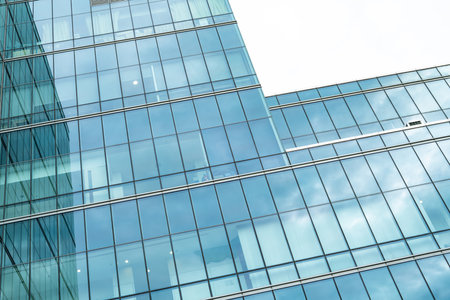 Modern sustainable glass office building. Exterior view of corporate headquarters glass building...